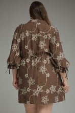 Load image into Gallery viewer, Floral ¾ balloon sleeve mini dress featuring a split neckline and adjustable tie cuffs.
